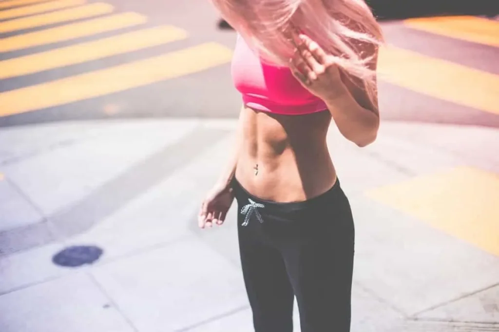 Woman with toned stomach after LA-EMS Body Sculpting Treatment West Hampstead